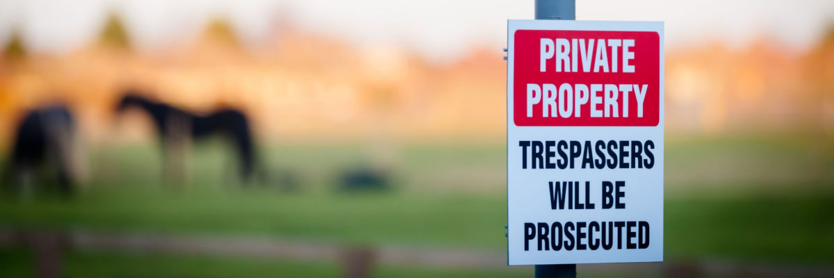 A sign saying 'Private Property - Trespassers will be prosecuted' to indicate Erin International's S.49 application services